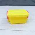 Miniature plastic storage box detail, cute yellow container with pink latches, dollhouse prop. - Yellow