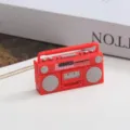 Detail view of a 1:12 scale dollhouse miniature red retro radio model, perfect for dollhouse decor. - Red Radio