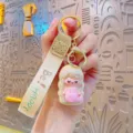 Cute iridescent mermaid keychain bag charm with fabric strap and gold metal keyring. - Holographic Yellow Mermaid