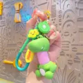 Cute cartoon dinosaur keychain with telescopic neck, kiwi fruit and cloud pendant for bags. - Pink