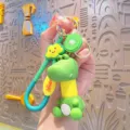 Cute cartoon dinosaur keychain with telescopic spring neck, kiwi and cloud charms. - Yellow