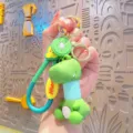 Cute cartoon dinosaur keychain with kiwi fruit pendant, fun telescopic neck toy bag charm. - Light Blue