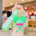 Mignon porte-clés poupée dessin animé vert avec sangle, joli pendentif drôle pour sac et clés. - Cheveux Explosifs Verts