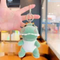 Llavero de dinosaurio de peluche lindo, colgante de bolsa suave y accesorio de mochila. - Verde