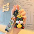 Cute cartoon dragon keychain holding a gold ingot, ideal year of the dragon gift and accessory. - Black Ingot Dragon