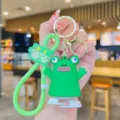 Cute green frog wind up toy keychain bag pendant with golden metal rings and nice strap. - Green Frog