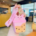 Portamonete in silicone maialino tè al latte, mini borsa porta auricolari con disegno animato. - Rosa