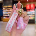 Colorful gradient monster keychain cute cartoon bag pendant with metal bell and pink strap. - Iridescent Cabbage Man / Pink