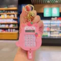 Pink cartoon cat calculator keychain with cute strawberry charm and metal ring pendant. - Pink