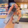 Cute cartoon bear keychain with bell and strap, creative bag pendant and car key ring ornament. - Gray