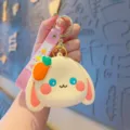 Cute cartoon rabbit silicone coin purse keychain with wrist strap and carrot charm for kids use. - Yellow