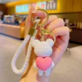 Cute resin heart bear keychain pendant with white braided strap for car keys and bags. - White