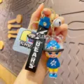 Cute cartoon monster keychain with bear helmet doll and black strap backpack ornament - Blue Monster