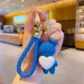 Cute blue bear keychain with braided strap and white heart pendant for bags and car keys. - Blue