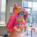 Cute PVC duck keychain with pink strap, stylish bag charm and car key accessory for daily use. - Pink Traveling Duck