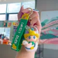 Cute PVC cartoon keychain with duck doll pendant, trendy car key ring and cute bag charm. - Green Traveling Duck