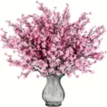 Ramo de flores artificiales rosas con florero de vidrio gris, ideal para decoración del hogar. - Rosa