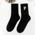Solid black mid-calf socks with white embroidered letter P design for women, cozy and stylish. - One Size / Letter P / Black