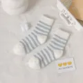Fuzzy striped mid-calf socks for women, cozy coral fleece material, warm winter floor socks. - One Size / Blue Wide Stripe