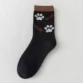 Black cotton mid-calf casual socks featuring cute paw prints and stylish WOW knit design. - One Size / Black