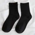 Women plain black mid-calf socks, soft and comfortable ribbed cotton crew socks for daily wear. - Black