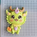 Detailed view of a cute green dragon resin cabochon charm, perfect for DIY phone cases and crafts. - Green