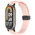 Vista dettagliata in primo piano del cinturino di ricambio in silicone rosa per smartwatch con fibbia. - Connettore nero + cinturino / Rosa loto