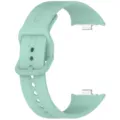 Green silicone replacement watch strap close-up detail, showing buckle and connector. - Teal