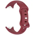 Detail view of replacement silicone watch strap with metal connector in dark red color. - Burgundy