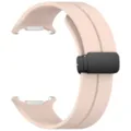 Detail view of the pink silicone smartwatch replacement strap with a black magnetic folding buckle. - Pink