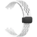Detail view of the breathable silicone watch strap with a secure magnetic folding clasp. - White