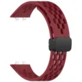 Detailed view of breathable silicone replacement watch band with magnetic folding clasp design. - Burgundy