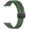 Close-up of green silicone watch band featuring breathable perforated design and magnetic clasp. - Field Green