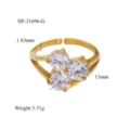 Detail close-up of the elegant 18K gold plated triple cubic zirconia open ring design. - Irregular Three Stone Style (HF-J1696-G)