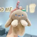 Cute plush rabbit keychain with carrot pendant, soft stuffed animal bag charm for backpack. - Brown
