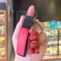 Red resin bear keychain with black strap cute bag charm and car key ring accessory. - Red Nordic Bear