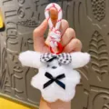 Cute white plush puppy keychain with cute bows and hanging rope, perfect backpack pendant gift. - Black Bow