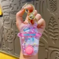 Transparent milk tea cup water game keychain with cute rabbit design, glitter and floating rings. - Animal Water Game - Rabbit