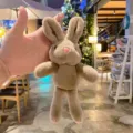 Cute brown rabbit plush toy keychain pendant for bag decoration, soft and fluffy cartoon doll. - Coffee