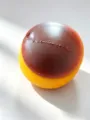 Sphärisches Anti-Stress-Spielzeug in Gelb und Schokobraun für Erwachsene und Kinder geeignet - Pudding-Block