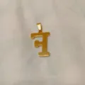 Minimalist gold letter pendant necklace in titanium steel, chic fashion jewelry accessory. - Alphabet F Pendant (DX611) / Gold