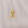 Gold letter X pendant necklace in minimalist titanium steel fashion design for women and girls. - Alphabet X Pendant (DX611) / Gold
