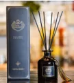Black glass reed diffuser set with elegant packaging box, ideal for home fragrance decor. - Hilton