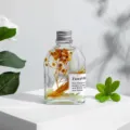 Glass aroma diffuser bottle with dried flowers and stones for home fragrance and decor display. - 200ml / Miss Coco