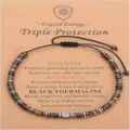 Detail view of triple protection crystal bracelet featuring hematite tigers eye black tourmaline beads. - Triple Protection Tiger Eye Hematite Bracelet