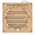 Detail view of healing crystal beaded pregnancy bracelet on descriptive gift card - Healthy Pregnancy Pink Natural Stone Gold
