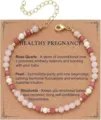 Detailed macro shot of a rose quartz and pearl beaded bracelet on a kraft gift card - Healthy Pregnancy - Pink Stone Gold Style