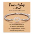 Elegant silver beaded friendship bracelet with heart infinity knot on a kraft gift card - Friendship Infinity Knot Style / Silver