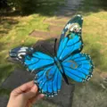 Blue metal butterfly wall art, detailed view of handcrafted iron hanging decor for home garden. - Blue