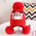 Children winter warm red knit hat with cute reindeer pattern and three fluffy pom poms. - Red